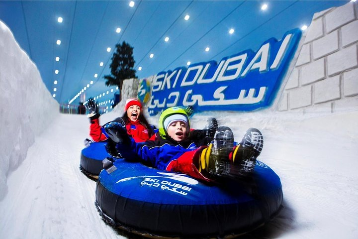 Experience the joy of snow-filled fun at Ski Dubai where tobogganing and rolling in transparent globes elevate your winter adventure in the heart of the desert.